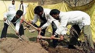 Police later exhumed the bodies of the killed men