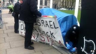 Police removing the last anti-war tent