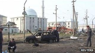 Police inspect the scene of a bomb blast in Makhachkala, Dagestan, 4 May