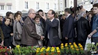 Francois Hollande meets people at Tulle market