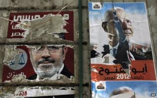 Defaced posters for Islamist presidential candidates Mohammed Mursi and Abdul Moneim Aboul Fotouh (7 May 2012)