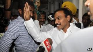 Former Indian Telecom Minister, and Dravida Munnetra Kazhagam (DMK) party lawmaker Andimuthu Raja, right, waves to the media at his official residence in New Delhi, India, Tuesday, May 15, 2012.