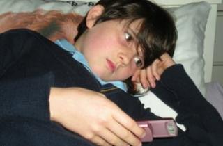 A child with a mobile phone