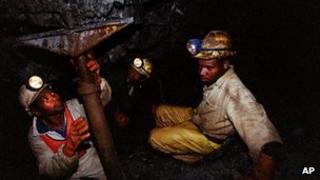 Miners work underground at the Harmony Goldmine, near Carletonville, South Africa, Wednesday 27 October 2004