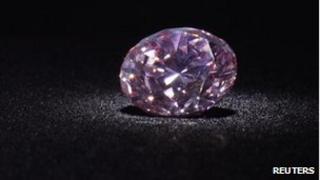 The Martian Pink, a 12.04-carat Fancy Intense pink (Type IIa) diamond, is shown during a media preview at Christie's in Hong Kong, 8 May, 2012