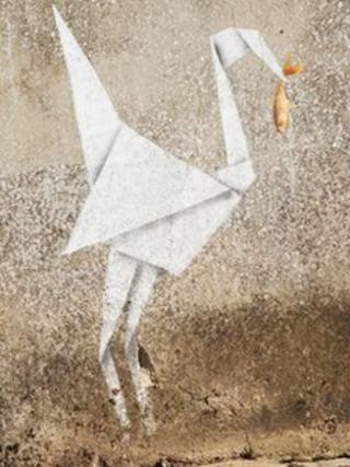 Andrew Blackmore's picture of Banksy's origami heron catching goldfish