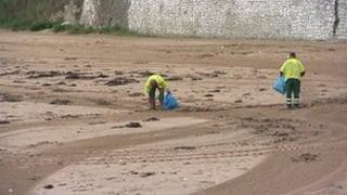 Beach cleaners on a beach in Thanet