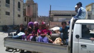Family fleeing home in Syria