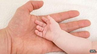 Father's and baby's hands