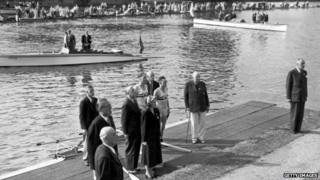 Burnell and Bushnell wait to receive their gold medals after winning the double sculls final