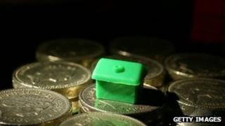 Monopoly pieces on coins