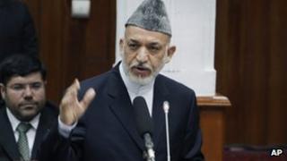 President Hamid Karzai speaks to lawmakers in parliament on Thursday