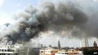 Smoke from the burning Mantralaya building, which houses the Maharashtra state secretariat, is pictured moving past the Mumbai skyline on June 21, 2012.