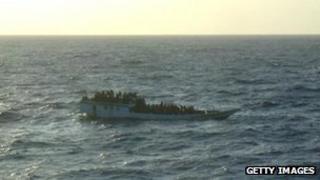 In this handout photo provided by Australian Maritime Safety Authority, a boat carrying 150 suspected asylum seekers is spotted prior to the vessel sinking north of Christmas Island, on 27 June, 2012.