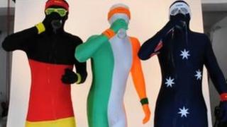 Three people in morphsuits