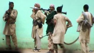 Still from a video shows armed Islamists patrolling in the streets of Gao on 27 June 2012