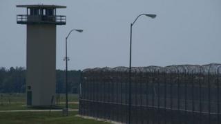 Prison fence and watch-tower Livingston, Texas