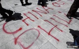 Graffiti by activists in front of the Chinese consulate in Manila, April 2012