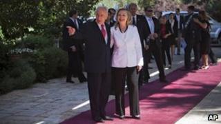 Israel's President Shimon Peres, left, welcomes US Secretary of State Hillary Rodham Clinton, prior to their meeting at the president's residence in Jerusalem