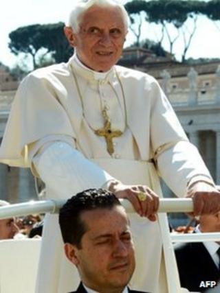 Paolo Gabriele (Bottom), the pope's butler, sits in the popemobilenext to Pope Benedict XVI as they arrive in St. Petr's square on April 18, 2012
