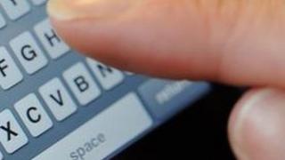 Someone text messaging on an iPhone