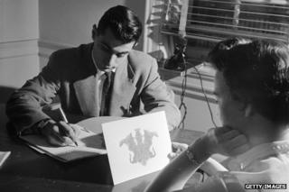 Psychologist conducting Rorschach test