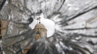 File picture of a church dome seen through the broken window of the Sednaya Convent in Sednaya, north of Damascus
