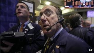 Traders work on the floor of the New York Stock Exchange