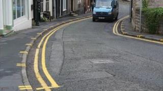 Yellow lines and pavement markings on Well Street, Ruthin