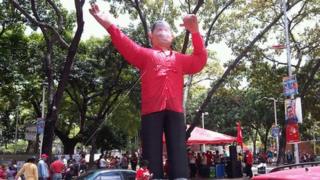 An inflatable figure of Hugo Chavez outside a polling booth in Caracas, Venezuela