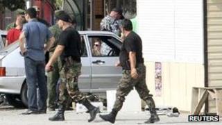 Investigators work at the site of an explosion in Grozny, the capital of Russia's Chechnya region