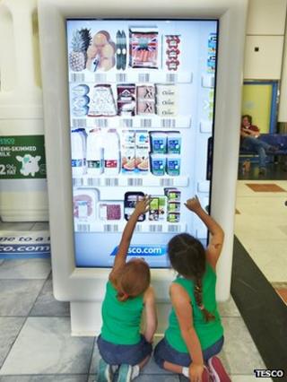 Kids use Tesco shopping machine