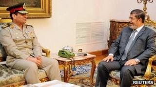President Mursi, right, with new defence minister Abdul Fattah al-Sissi. 13 Aug 2012
