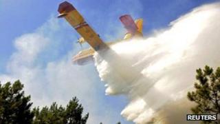 Water bomber being used to fight a forest fire near the western French resort of Lacanau on 17 August 2012