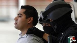 Federal police parade suspect Bogard Felipe Lugo de Leon before the media