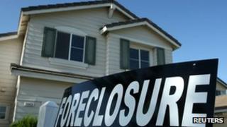 A foreclosure sign is posted in front of a home for sale in Stockton, California 29 April 2008