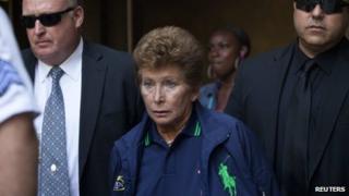 Lois Ann Goodman, 70, is led away from the Manhattan Criminal Court in New York 23 August 2012