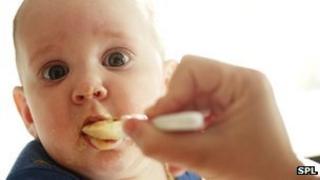 Baby being fed