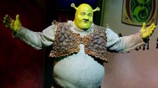 Dean Chisnall in Shrek the Musical. Photo by Tristram Kenton