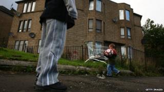 Children playing in run down area