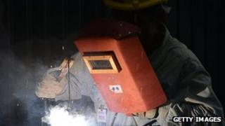 man welding in factory