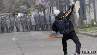 Demonstrator throws Molotov bomb at Chilean police