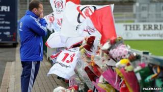 Mourner at tribute site