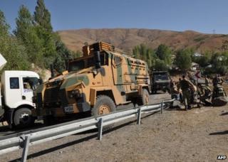 Turkish troops check the site of an attack in Bingol province, 16 September