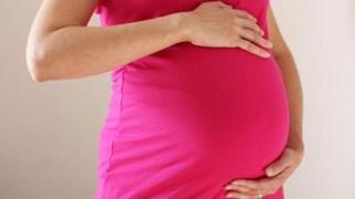 File photo from 2010 of a woman eight months into her pregnancy
