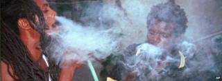Rastafarians smoke marijuana in Kingston, Jamaica - August 1999