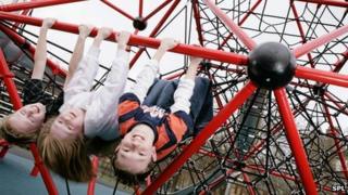 Children playing on climbing frame