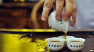 Tea poured into Chinese tea cups