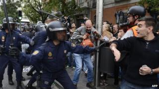 Riot police and demonstrators in Madrid