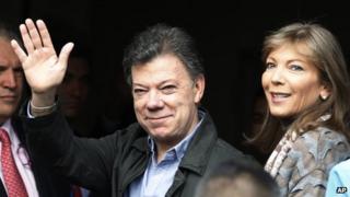 Colombia's President Juan Manuel Santos arriving at a Bogota clinic, with his wife Maria Clemencia Rodriguez